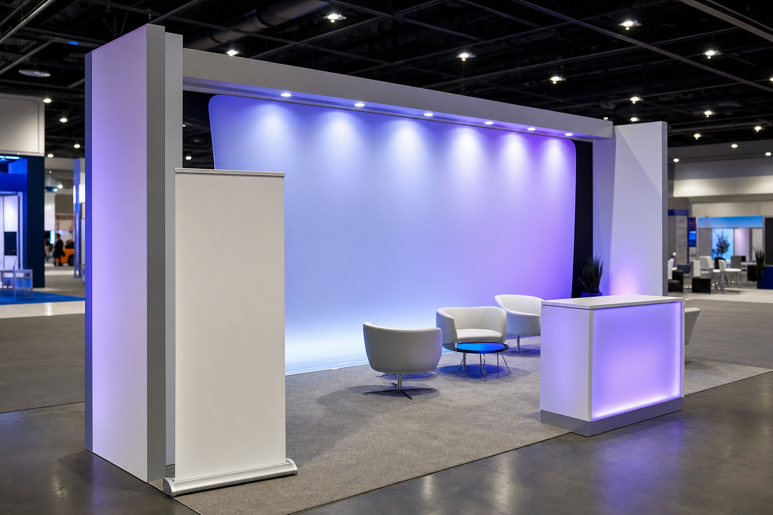 A sleek modern trade show booth with blank fabric graphic panels and a banner stand under bright expo hall lighting